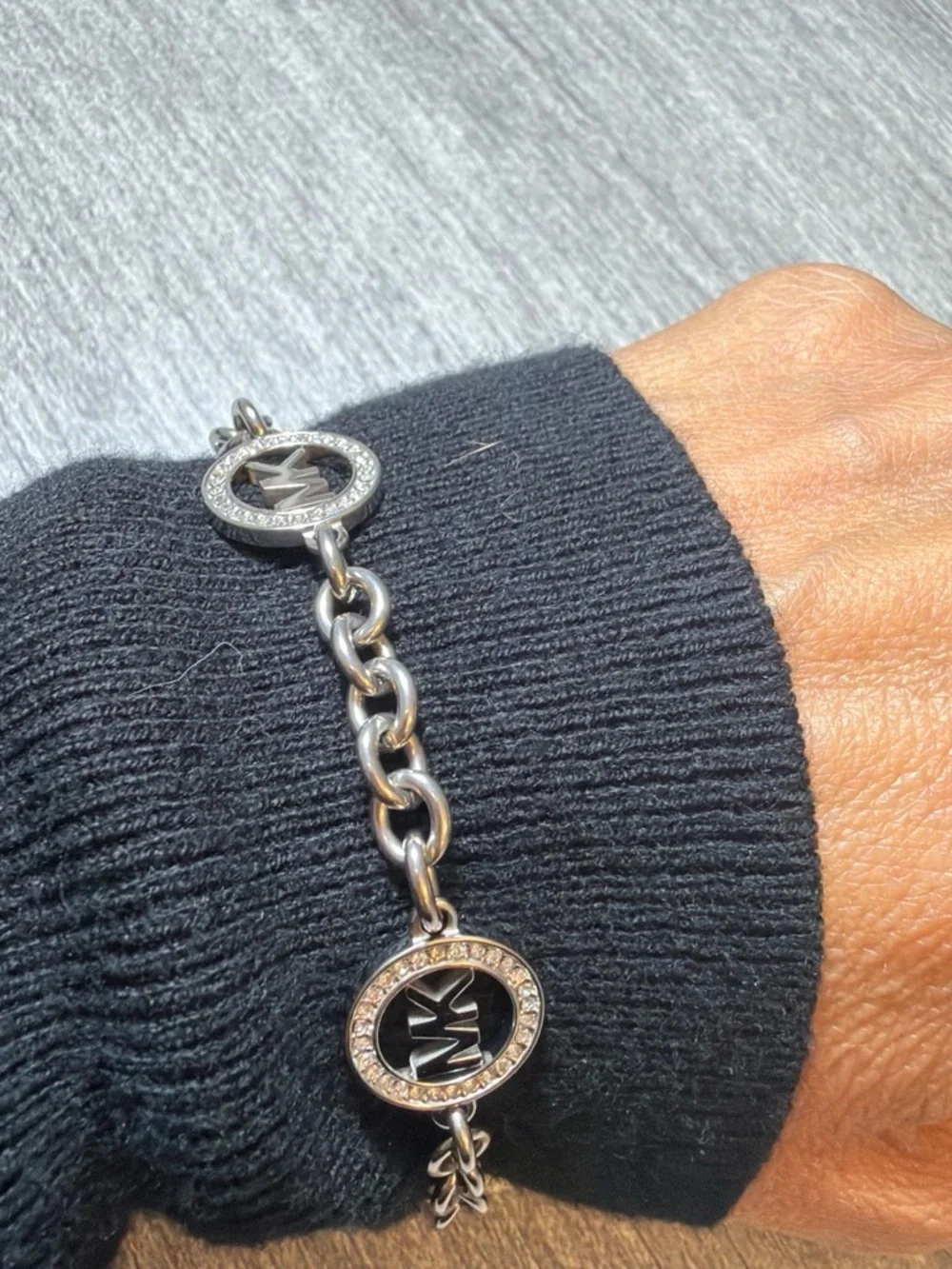 Michael Kors Silver-Tone MK Charm Chain Bracelet with Crystal Rings